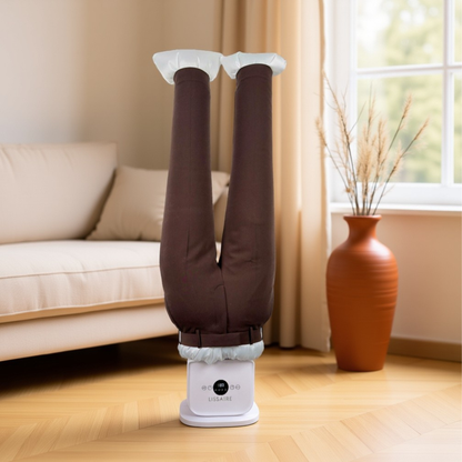 Automatic ironing machine pressing a pair of trousers on Lissaire