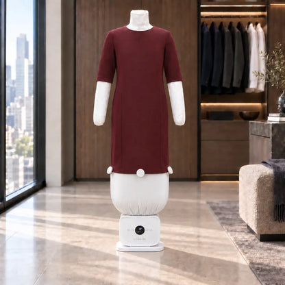 A burgundy dress being pressed on the Lissaire ironing machine with the dress attachment in a walk-in wardrobe